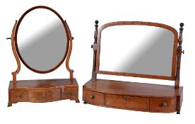 A Regency mahogany and ebonised platform dressing table mirror , circa 1815, of break bowfront