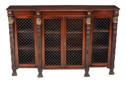 A mahogany side cabinet in Empire taste , 20th century, with Egyptian revival mounts to the