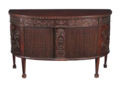 A carved mahogany side cabinet , in George III style, circa 1900, of bowfront outline, after the