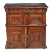 A Charles II oak chest, late 17th century, with two long drawers each with moulded front above a