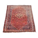A Shiraz carpet , approximately 214cm x 312cm