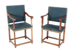 A pair of Continental walnut and upholstered armchairs , 17th century and later