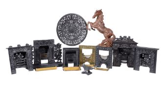 A collection of seven George III miniature metal models of hobgrates, early 19th century, six of