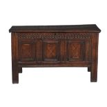 A panelled oak and inlaid chest, mid 17th century or later, the triple panelled front