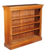 A walnut open bookcase , late 19th century, with bank of three adjustable shelves,