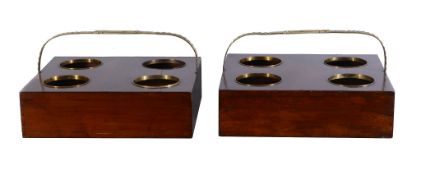 A pair of George III mahogany and brass mounted decanter carriers , circa 1810, with gilt brass