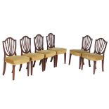 A set of six George III mahogany dining chairs , circa 1790, each with a shield backs