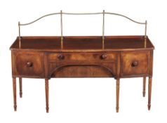 A George III mahogany and crossbanded bowfront sideboard, circa 1800, incorporating four drawers,