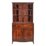 A George III mahogany secretaire bookcase , circa 1800, the astragal glazed doors enclosing