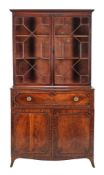 A George III mahogany secretaire bookcase , circa 1800, the astragal glazed doors enclosing