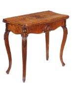 A Victorian walnut card table in French taste , circa 1860, the bookmatched veneered top with
