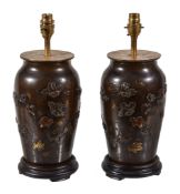 A pair of Japanese patinated bronze table lamps, Meiji period, late 19th century and later adapted