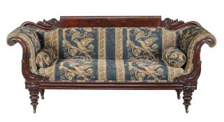 A Victorian mahogany and upholstered sofa, circa 1850, the scrolling showframe above lappet carved