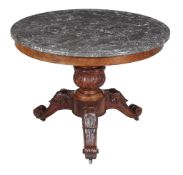 A French mahogany circular centre table , mid-19th century, with black fossilised marble top above