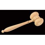 Ω A Victorian turned ivory gavel, mid 19th century, the baluster handle with ebonised knop and bead