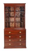 A George III mahogany secretaire bookcase , late 18th century, the bookcase top with adjustable