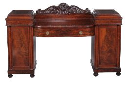 A George IV mahogany pedestal sideboard, circa 1825, the acanthus and twin scroll carved cresting