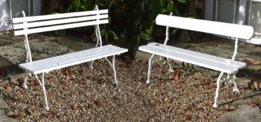 Two similar cast iron and slatted wood garden benches, circa 1900, the backrests and seats held in