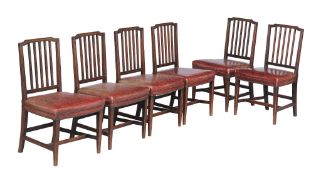 A set of six George III mahogany and leather upholstered dining chairs , circa 1800, each with