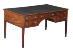 A Regency mahogany partners desk, circa 1815, the rectangular top with gilt tooled leather inset
