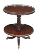 A George IV mahogany two tier whatnot, circa 1825, attributed to Gillows, the circular top with