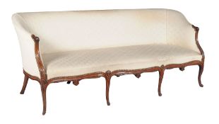 A George III mahogany sofa, circa 1770, in the French Hepplewhite manner , the shaped rectangular
