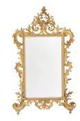 A Continental carved giltwood wall mirror, in 18th century style, late 19th century, probably