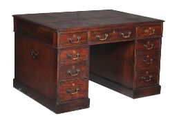 A George III mahogany partners desk, circa 1770, the tooled leather inset top above three frieze