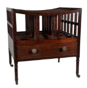 A Regency mahogany six division Canterbury, early 19th century, of rectangular form with swept top,