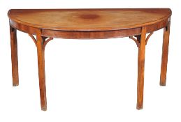 A mahogany side table , early 19th century, of semi-elliptical outline, 72cm high, 144cm wide, 71cm