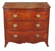 A George III mahogany chest of drawers , circa 1810, of bow front outline, with brushing slide