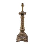 A Victorian gilt bronze table lamp, circa 1880, with Composite Order capital above a foliate cast