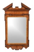 A walnut and parcel gilt wall mirror after the manner of William Kent , late 19th century, with