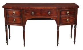 Ω A Regency mahogany and ebony inlaid sideboard , circa 1820, the central drawer flanked by