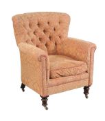 A Victorian mahogany and button upholstered armchair, circa 1860, covered in a Paisley or Kashmir
