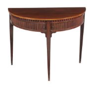 A Dutch mahogany semi elliptical side table, circa 1800, the dentil frieze above twin sliding