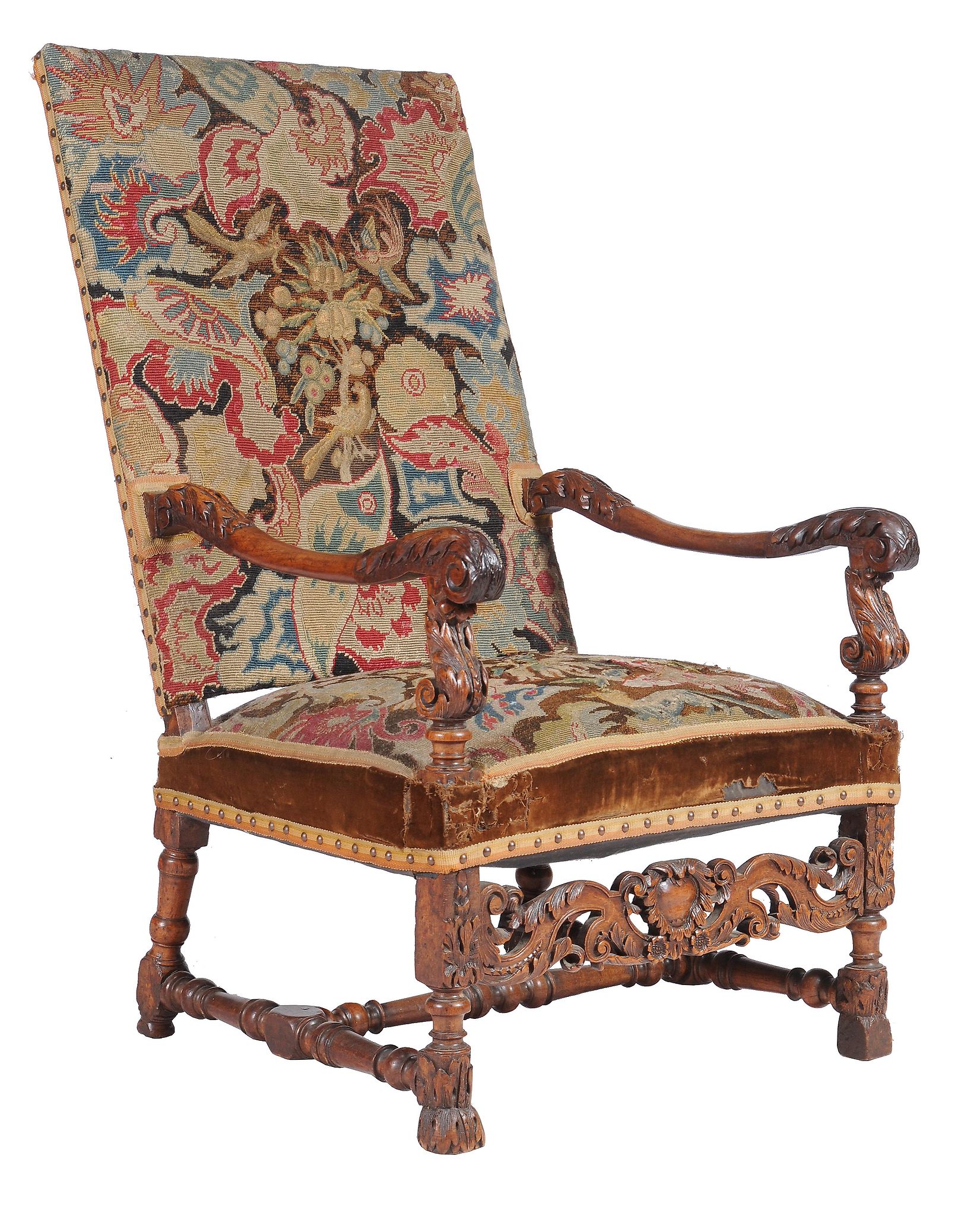 A Louis XIV carved walnut armchair, late 17th/ early 18th century, the rectangular back and seat