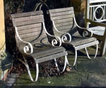 A pair of painted wrought iron and slatted hardwood garden chairs, 20th century, each with scrolled