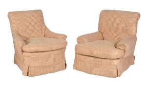 A pair of Victorian upholstered armchairs , late 19th century in the manner of Howard & Sons, each