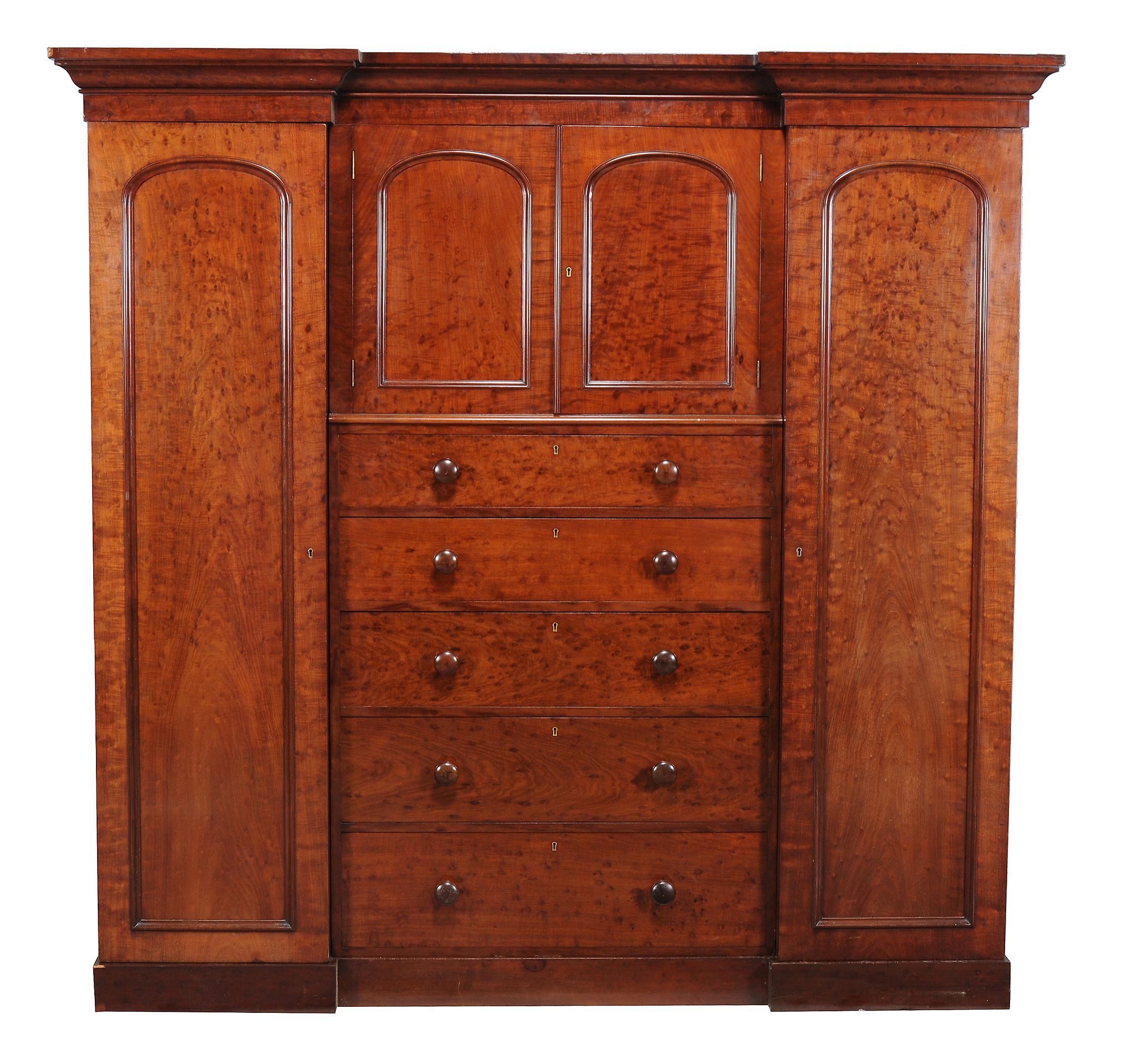 A Victorian mahogany triple section wardrobe, circa 1870, the exterior veneered with mahogany of '