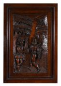 A Spanish carved and stained walnut figural panel, in 16th century taste, early 20th century,