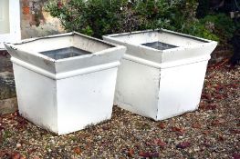 A pair of white painted zinc garden planters, later 20th century, of square section and tapering