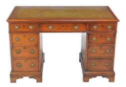 A mahogany twin pedestal desk in George III style, circa 1900, 75cm high, 121cm wide, 68cm deep