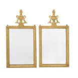 A pair of Continental carved giltwood wall mirrors, first half 19th century and later, possibly