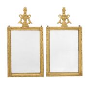 A pair of Continental carved giltwood wall mirrors, first half 19th century and later, possibly