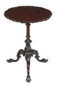 A mahogany tripod table, first half 19th century, the circular shaped top with pie crust edge above