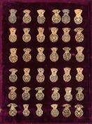 A collection of thirty-six English gilt brass pocket watch back cocks Anonymous, 18th century