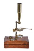 A mahogany cased field microscope, early 19th century, the fitted interior housing the brass