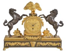 A Regency ormolu and patinated bronze mantel timepiece Unsigned, early 19th century The circular