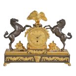 A Regency ormolu and patinated bronze mantel timepiece Unsigned, early 19th century The circular